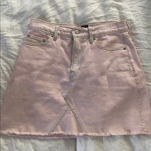 Pink denim skirt with frayed hem